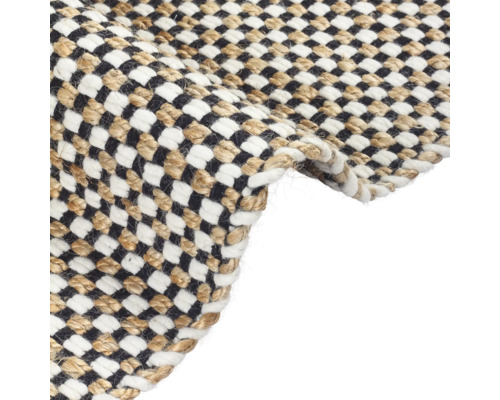 Detailopname van een tapijt met een schaakbordpatroon