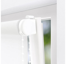 Close-up van een wit rolgordijn op een raam