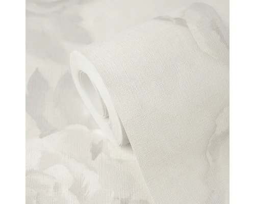 Rol behang met gestructureerd oppervlak en subtiel bloemenpatroon.