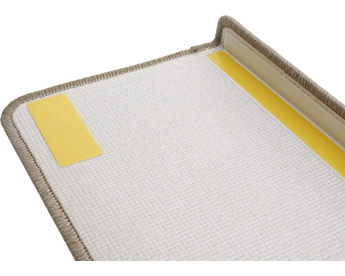 Detailweergave van een trapmat met plakstrips