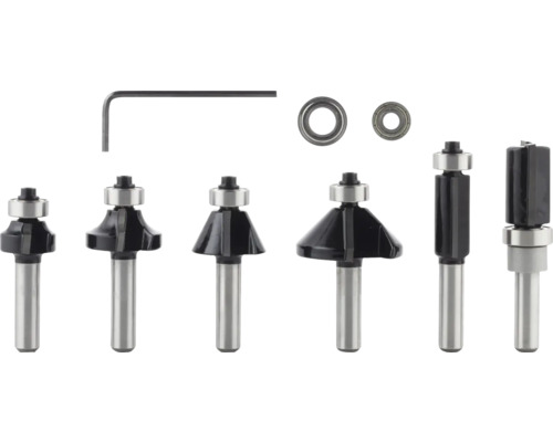 Meerdelige metalen bovenfrezenset met diverse profielfrezen, twee kogellagers en een inbussleutel.