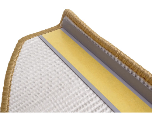 Detailopname van een tapijtrand met bevestigingsstrips