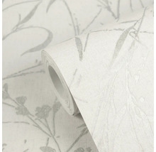 Rol vliesbehang met grijs botanisch patroon van takken en bloemen en textielstructuur.