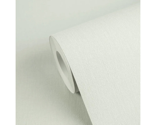 Close-up van een rol vliesbehang met een fijne verticale structuur.