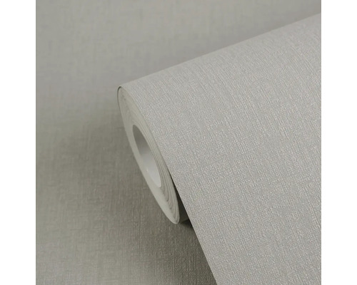 Rol vliesbehang met fijne textielstructuur.
