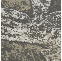 Detailopname van vliesbehang met een gestructureerd abstract patroon.