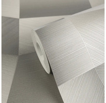 Grijs vliesbehang op rol met geometrisch patroon en fijne lijnstructuur.