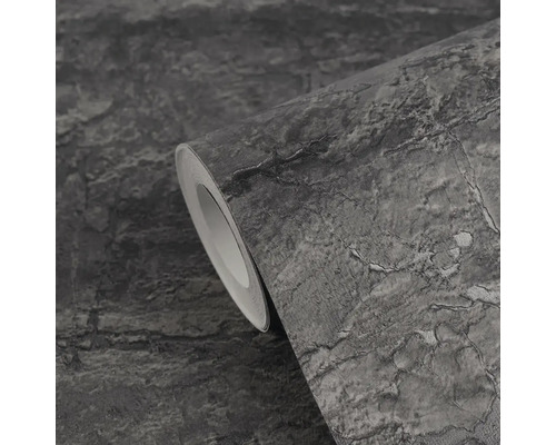 Vliesbehang met steenlook, donkergrijs, gestructureerd oppervlak met barsten, detailweergave van een rol.