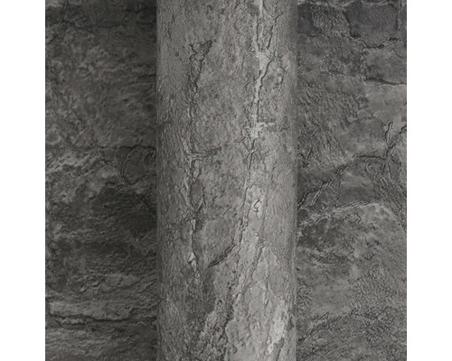 Grijs vliesbehang met steenlook en gestructureerd oppervlak.