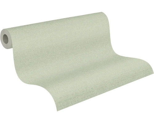 Gedeeltelijk afgerolde lichtgroene behangrol met een fijne textielstructuur.