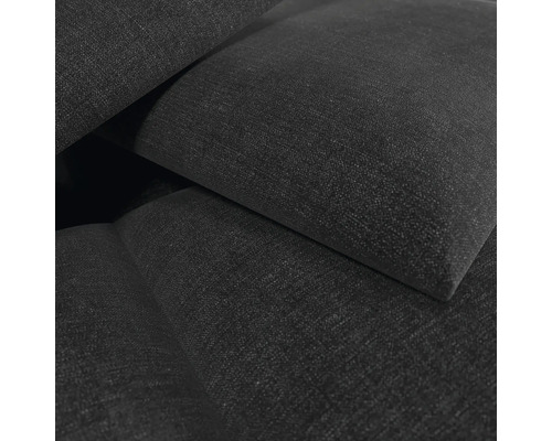 Detailweergave van een gestoffeerd meubelstuk met een geweven stoffen oppervlak.