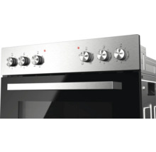 Bedieningspaneel van een inbouwoven van roestvrij staal met zes draaiknoppen en een handgreep.