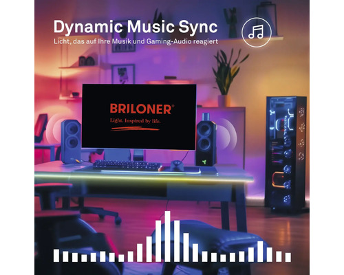Gaming-setup met monitor inclusief Briloner Logo, luidsprekers en pc-behuizing, verlicht door muziekgesynchroniseerde slimme ledverlichting.