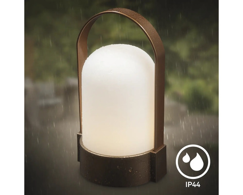 Draagbare buitenlamp met ronde draagbeugel en matte diffuser, spatwaterdicht volgens beschermingsklasse IP44.
