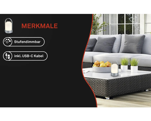 Draagbare lamp op een witte tafel in een lichte loungehoek met rotan meubels. Kenmerken: trapsgewijs dimbaar en inclusief USB-C-kabel.