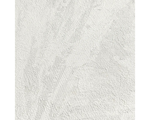 Wit behang met fijne structuur in pleisterlook of steenlook.