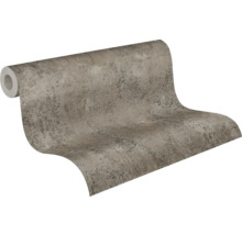 Vliesbehang met steenlook en betonstructuur in grijs en beige.