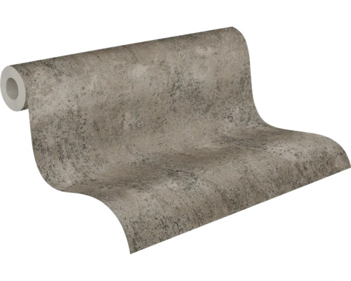 Vliesbehang met steenlook en betonstructuur in grijs en beige.