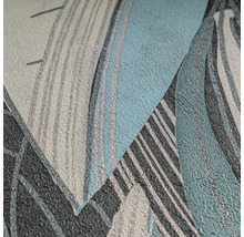 Vliesbehang met abstract bladmotief en fijne textuur.