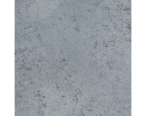 Detailopname van behang in betonlook met een gestructureerd oppervlak.