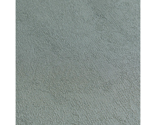 Gestructureerd vliesbehang in grijs met pleistereffect.