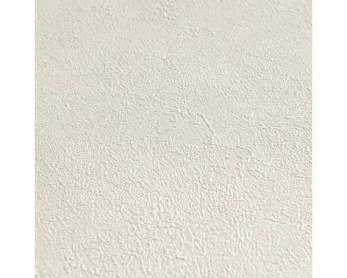 Gestructureerd vliesbehang met een fijne, onregelmatige korrel in crème.