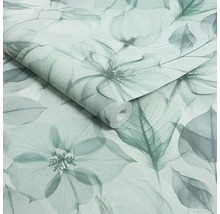 Vliesbehang met blad- en bloemmotief, transparante look, gedeeltelijk uitgerolde behangrol.