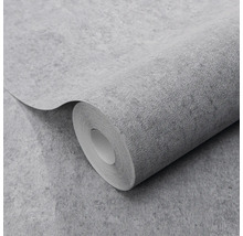 Gestructureerd behang met betonlook op een rol.