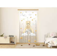 Halfdoorzichtig paneelgordijn voor de kinderkamer met aquarelmotief van een teddybeer op een regenboog met sterren en wolken.
