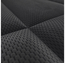 Detailweergave van een gestructureerde meubelstof met wafelpatroon.