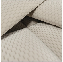 Close-up van gestructureerde meubelstof met een wafelpatroon.