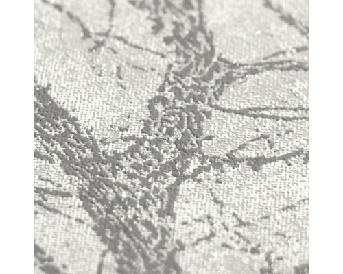Detailopname van vliesbehang met een gestructureerd oppervlak en een takkenpatroon.
