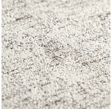 Detailopname van gestructureerd behang met pleisterwerk-effect.