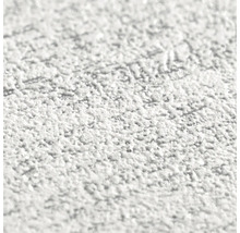 Close-up van een witte, grove stucwerkstructuur.