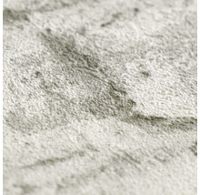 Detailopname van een gestructureerd behang met marmerlook.