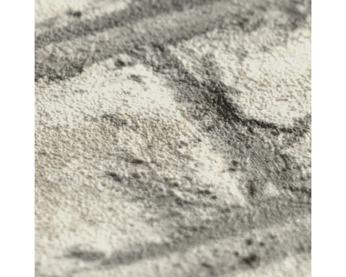Detailopname van behang met een gestructureerd oppervlak en abstract patroon.