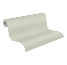 Behang met subtiele linnenstructuur, lichtbeige, gedeeltelijk afgerold.