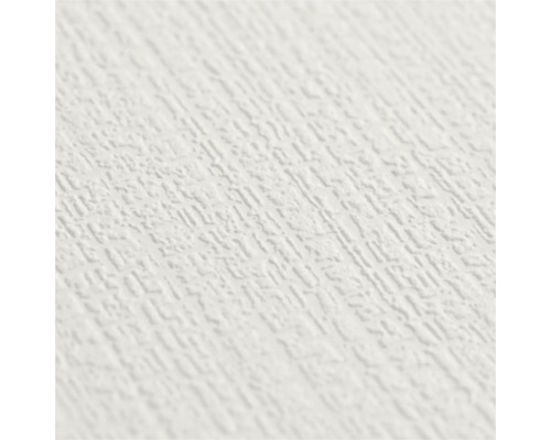 Detailopname van wit behang met een fijne, gestructureerde oppervlakte in pleisterlook.