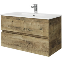 Wastafelonderkast in houtlook eiken met twee laden, witte wastafel en verchroomde kraan.