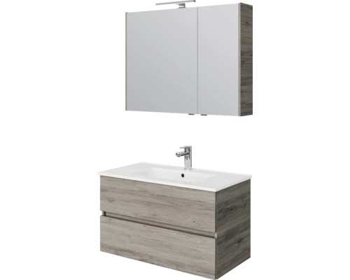 Badkamermeubelset: wastafelonderkast in houtlook met twee laden, witte wastafel met kraan en spiegelkast met ledverlichting.