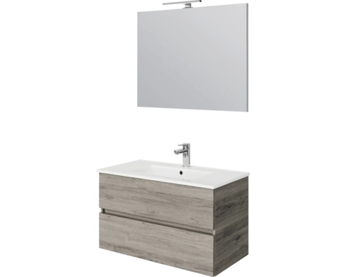 Badkamermeubelset met wastafelonderkast in houtlook, twee lades, witte wastafel en spiegel met verlichting.