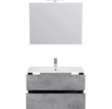 Moderne badkamermeubelset met een witte wastafel, grijze onderkast in betonlook met twee lades en een spiegel met verlichting.