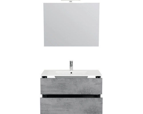 Moderne badkamermeubelset met een witte wastafel, grijze onderkast in betonlook met twee lades en een spiegel met verlichting.