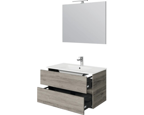 Badkamermeubelset bestaande uit een wastafelonderkast in houtlook met twee laden, witte wastafel, kraan en spiegel met ledverlichting.
