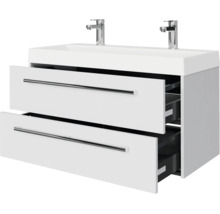 Witte wastafelmeubel met dubbele wastafel, twee laden en twee verchroomde kranen.