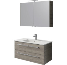 Badkamermeubelset: spiegelkast met lamp, wastafelonderkast in grijs houtlook met twee laden en witte wastafel met kraan.