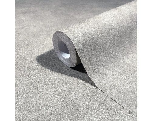 Rol vliesbehang met betonlook en een gestructureerd oppervlak voor wandafwerking.