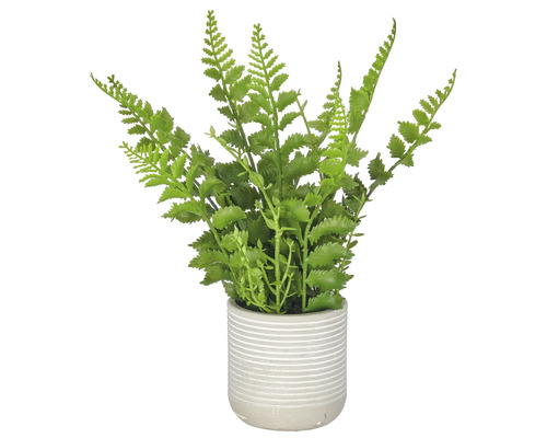 Kunstmatige varenplant in een geribbelde bloempot als decoratieve kamerplant.