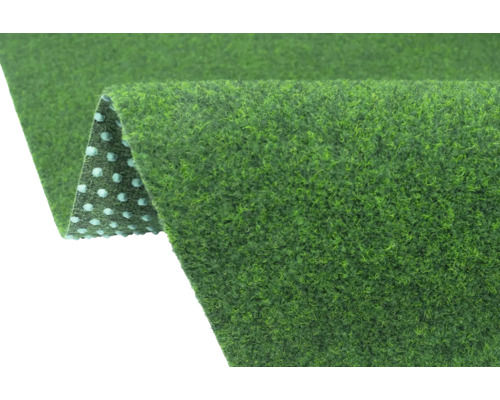 Groen kunstgras tapijt met drainagenoppen aan de onderzijde.