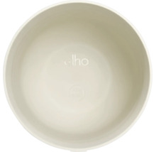 Binnenkant van een ronde kunststof plantenpot met elho Logo en symbool voor 100 procent recyclebaar.